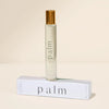 Roll-on perfume bottle of PALM fragrance with a matching box. Fragrance notes of Coconut Husk, Jasmine, Patchouli with an Amber base. 10 mL