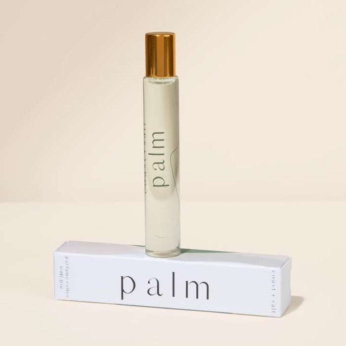 Roll-on perfume bottle of PALM fragrance with a matching box. Fragrance notes of Coconut Husk, Jasmine, Patchouli with an Amber base. 10 mL