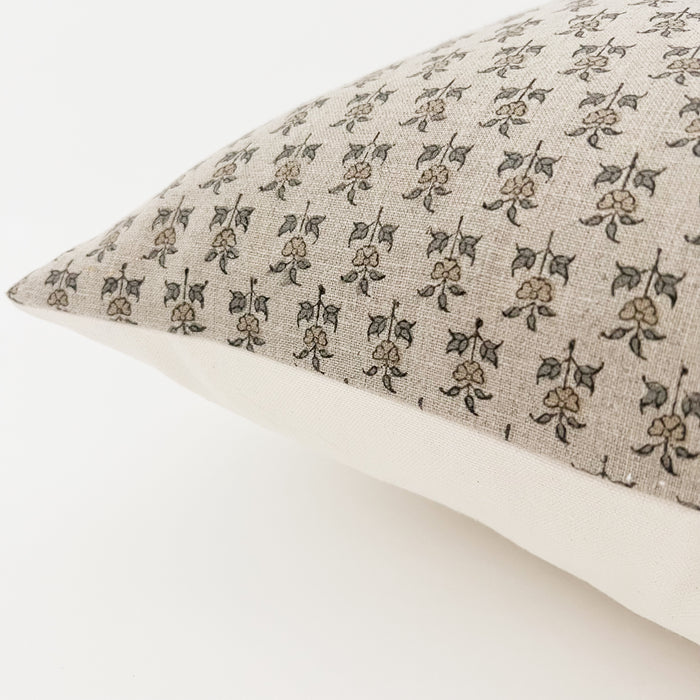 Side view of the Pari Pillow. Block printed face on a neutral linen with a solid ecru back. 20" square, down insert included.