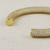 Close up of open ended gold pave' arm cuff. 18k gold filled with AAAA quality micro CZ stones.