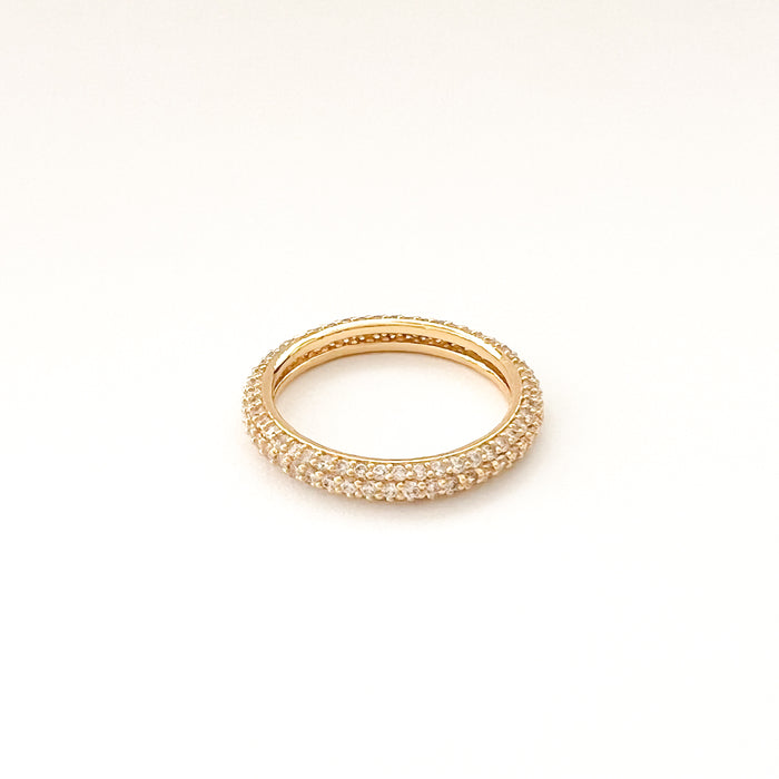 Pave' eternity ring by Tai jewelry. A classic rounded gold plated eternity ring encrusted with clear pave' CZ stones. 