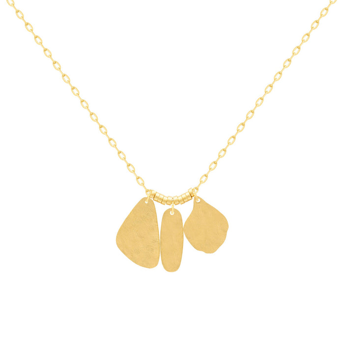 A gold necklace with three flat, hammered organically shaped pendant charms on a delicate chain, shown against a plain white background. 18k gold over brass.