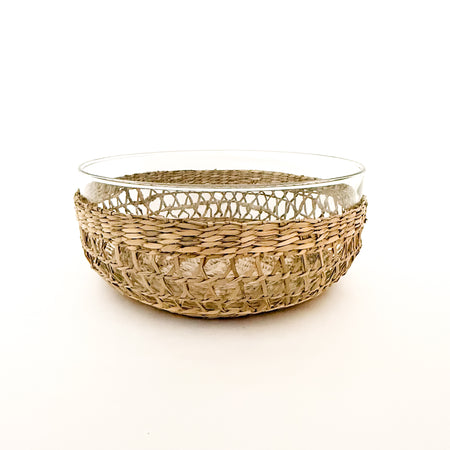Clear glass serving bowl with an intricately woven natural seagrass "cage". 9.75" diameter, 4 3/8" depth. 