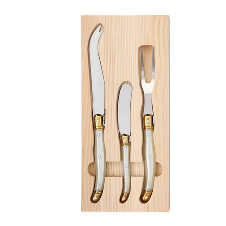 Set of three stainless steel cheese knives with ivory pearl handle and brass colored accents in natural Pine Wood box tray.