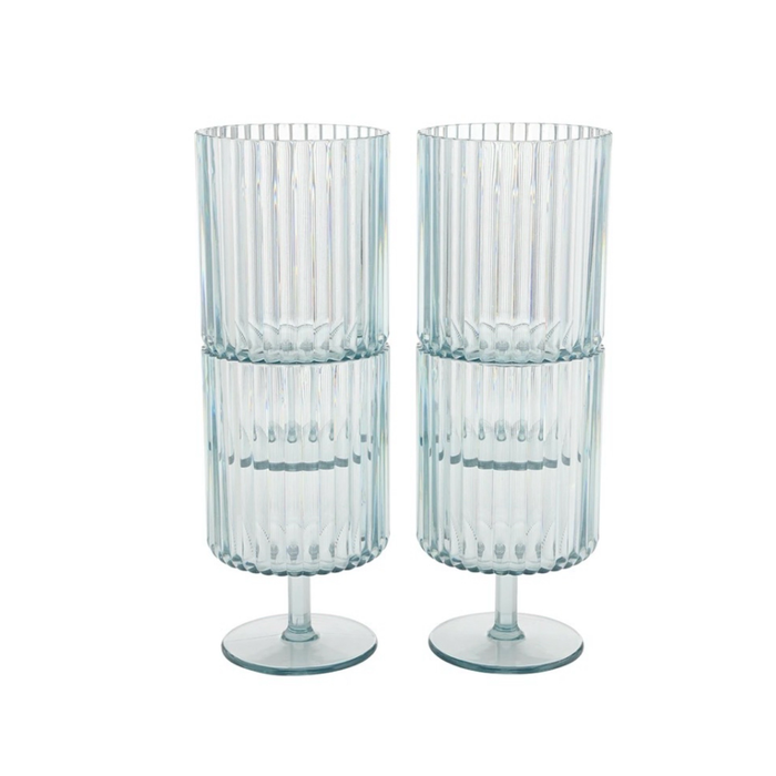 Two stacks of pale blue fluted wine goblets. Made of reuasable acrylic, ideal for outdoor entertaining. Sold as a set of 4. Each holds 15 oz.