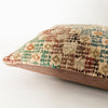 Lumbar pillow with a face made of a vintage Turkish textile with a solid brown cotton back. 12 x 24 inch lumbar pillow made from vintage Turkish textile.