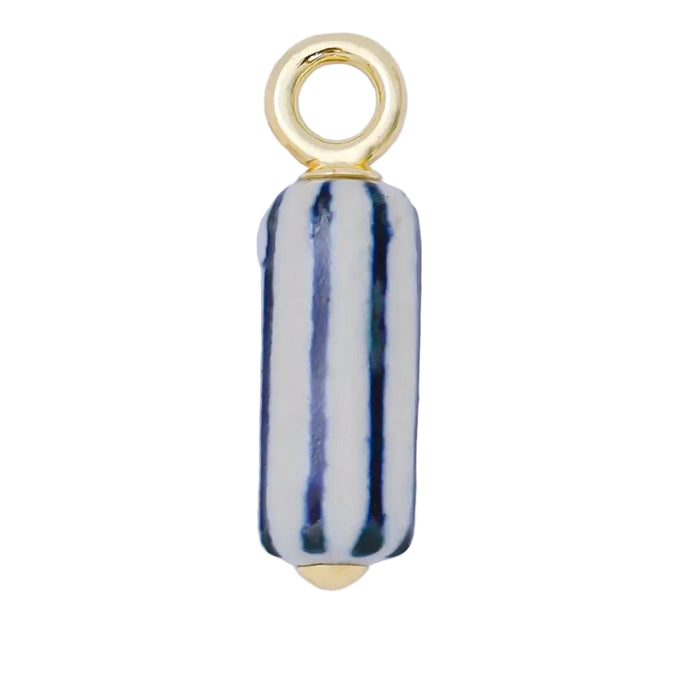 Blue and white striped porcelain pendant charm with gold fittings on white background.