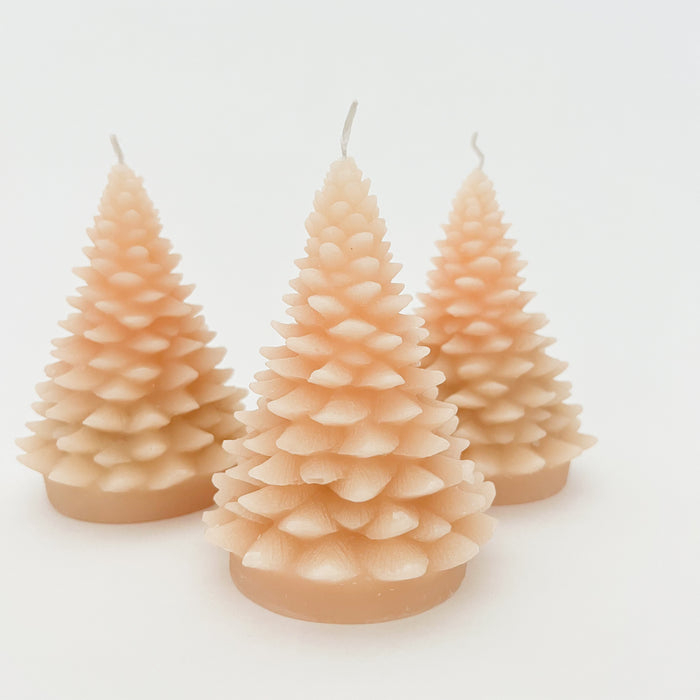 Grouping of three taupe tree shaped candles. Unscented and hand poured. Perfect holiday accent for the neutral home. Sold individually. 5" H x 3.75" diameter.