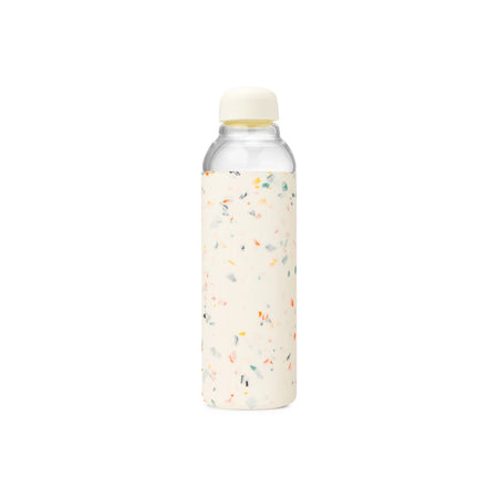 Modern wide mouth Borosilicate glass bottle with an ivory silicone sleeve in a stylish multi color confetti pattern. Ivory airtight twist-off cap. 20 fl oz capacity. 7" height 3" diameter. BPA free. Dishwasher safe.