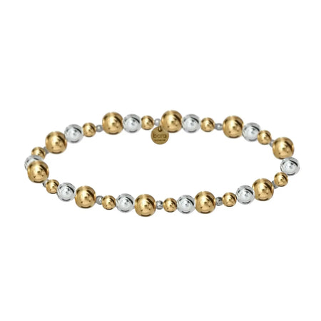 Tiff stretch bracelet. Shimmering 2 tone bracelet made with a mix of 14k gold filled balls and 925 sterling silver balls. Water and tarnish resistant. Stretch, one size fits most. 6.5 inch circumference.