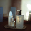 LAVUNE hand wash and other skincare products styled on a tray with a blurred background.