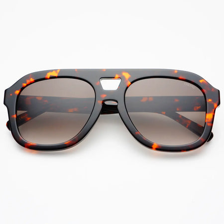 Aviator style sunglasses in a dark tortoise acetate frame with tinted lenses. 