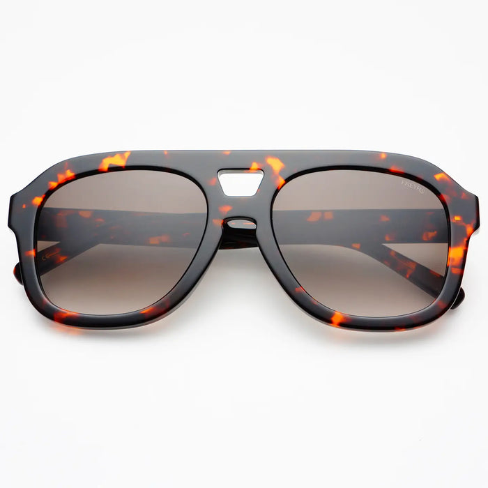 Aviator style sunglasses in a dark tortoise acetate frame with tinted lenses. 