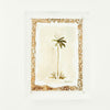 Watercolor of a palm tree with a neutral block printed matte framed in a clear lucite block. Measures 6" x 8"