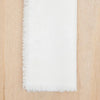 White linen 20" square napkin with frayed edges. Made of 100% linen. Sold as a set of 4.