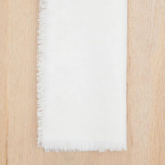 White linen 20" square napkin with frayed edges. Made of 100% linen. Sold as a set of 4.