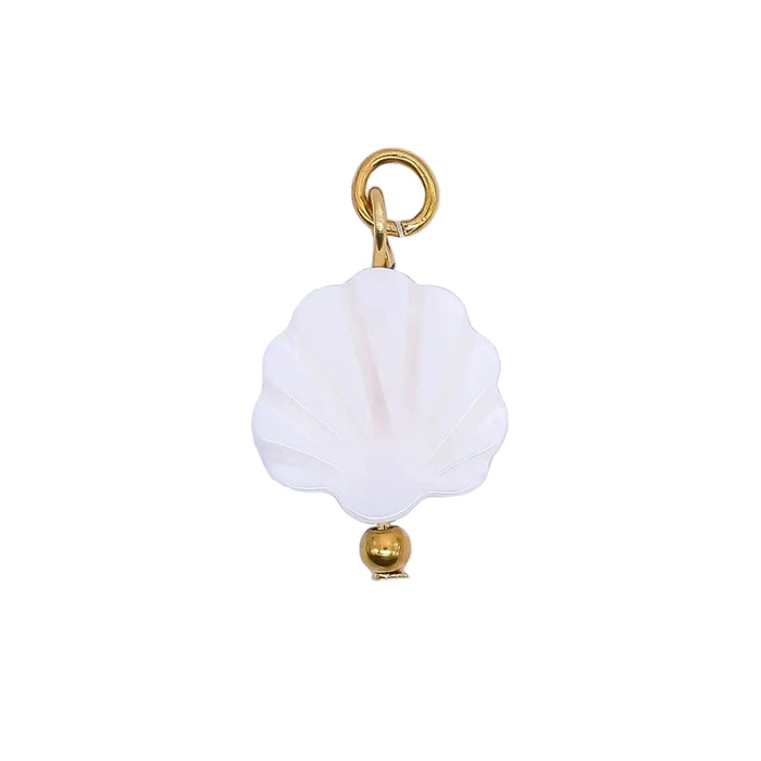 White shell charm with gold accents on a white background