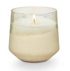 Winter White holiday candle by Illume. Fragrance grounded in warm cardamom with a heart of evergreen kissed with a light sparkling citrus. Clean burning, plant-based candle hand poured into a sanded champagne tinted glass vessel. 13 oz/ approximate 55 hour burn time.