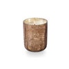 Woodfire Candle by Illume. Brown crackled glass vessel with reflective interior holds 8.3 oz candle made of plant based wax. Fragrance grounded in smoky Cedar with a heart of suede kissed with earthy amber. 