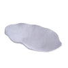 Shallow oval serving bowl in matte white melamine. Made by Beatriz Ball. 22.5 x 13 x 3.75 inches.
