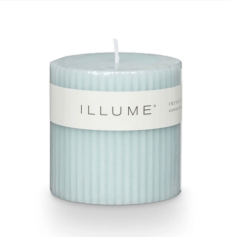 Fresh Sea Salt scented pillar candle. Soft aqua candle with a fluted profile. Fragrance notes grounded in fresh sea salt and jasmine. Comes with clear plastic wrapper. Measures 3" x 3". 