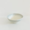 Small Shoreline ceramic bowl in a creamy white glaze with a blurred grey border. 4 inch diameter 1.5 inch high.