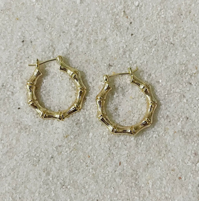 Pair of 18k gold filled bamboo hoop earrings. Hoop has a 5/8 inch diameter.A classic everyday essential. Hand crafted in the U.S.A.