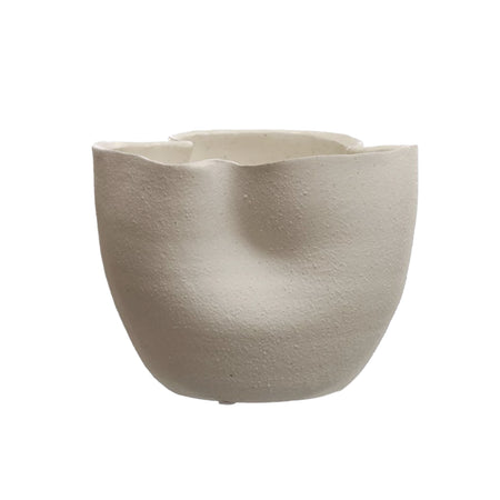Waves organic shaped stoneware vessel. Stoneware vessel with a wavy silhouette finished in a matte white "lava stone" glaze. Beautiful sculptural statement on its own or use as a planter. Measures 7.25" diameter, 5.5" high.