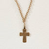 Vintage inspired cross with etching strung from gold chain and black onyx beads. 14k gold plated on 924 silver. Made by Bittersweet Designs. 24" length.