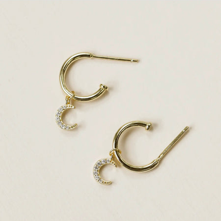 Crescent Moon hoop earrings. Mini golden hoops made of 14k gold vermeil over 925 sterling silver with a delicated crescent moon charm encrusted with CZ crystals. Outer diameter measures 12mm. Hand crafted in the U.S.A.