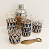 Newport Cane Glassware Collection shown with rattan cocktail shaker and antique brass fish bottle opener. All sold seperatley.