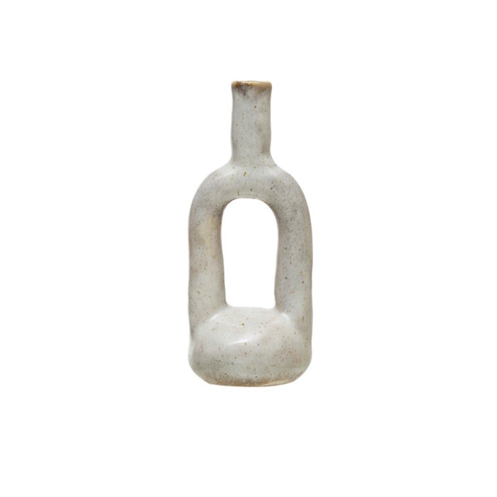 Sculptural Stoneware Vase in a glossy cream/taupe reactive glaze. The perfect modernist accent for shelf or table styling.  Measures 7"H 3" diameter.