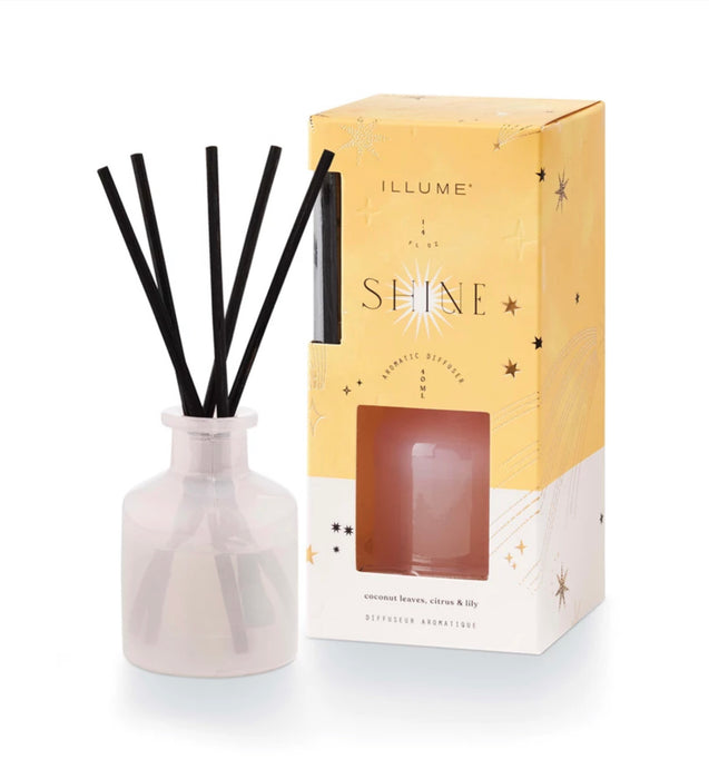 Shine mini diffuser set from Illume. Fragrance of coconut leaves, citrus and lily. Includes glass vessel, 1.4 fl oz of fragrance oil and reed sticks.