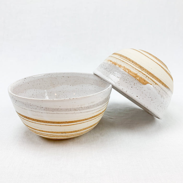 Ceramic Bowl made from swirls of cream and sand stoneware, hand dipped in a creamy white glaze. Each sold individually.