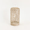 Seagrass cage carafe is perfect for the natural bohemian table. Made from recycled glass and wrapped in a hand woven seagrass cage. Measures 9" H 4" D at base.