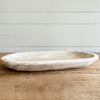 Our Whitewash Wood Platter is a beautiful addition to any table or counter. Hand carved in natural Paulownia wood and treated with a whitewash finish giving it an airy driftwood appearance. It's large size makes it a perfect center piece on the kitchen island or table. Measures 23"L 13"W.