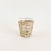 Small seagrass tumbler is perfect for the bohemian table. Made from clear recycled glass and wrapped in a hand woven seagrass cage. Measures  3.75"H 3"D at mouth.