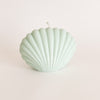 Seaside Shell candle in green adds beach vibes to any space. Makes a great gift. Hand poured in California. 100% unscented soy wax. Measures 3" H 4" W.