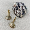 Clamshell Huggie Earrings plated in 24k gold, by Katie Waltman.