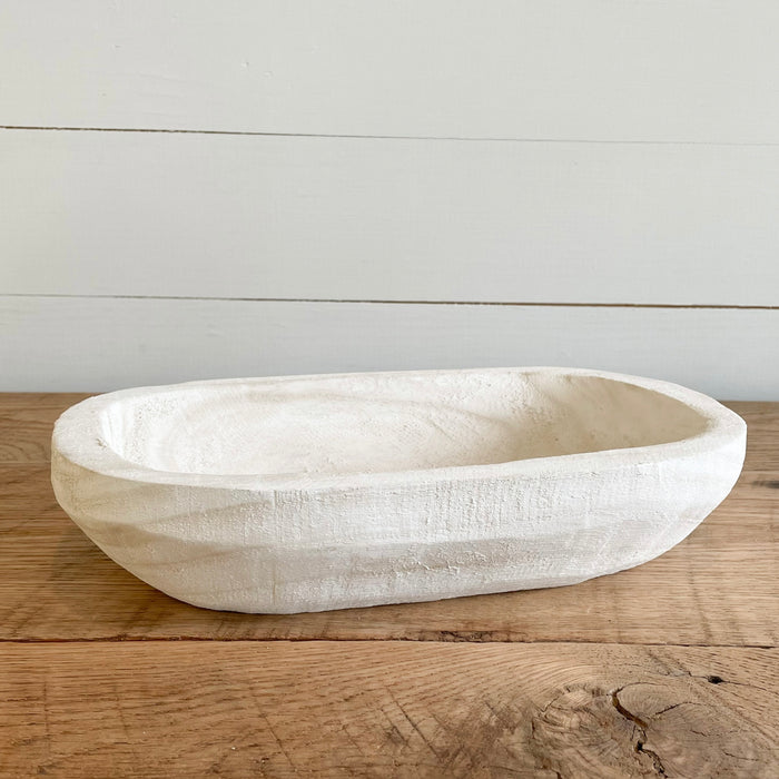 Our Whitewash Wood Bowl is hand carved from Paulownia wood. It's perfect for holding treasures on  a table or dresser. Measures 12.25"L, 7.25"W, 2.75"H.