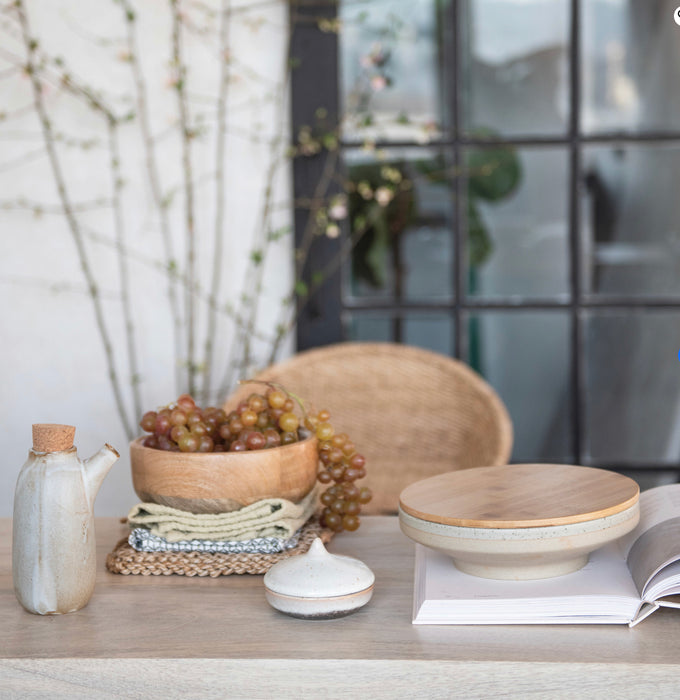 Modern farmhouse tabletop setting featuring the stonewash carafe and jute pot holder. Each sold separately.