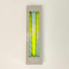 Set of 3, "Citron" Dip Dye Twisted Candles come packaged in a box perfect for hostess gifts. Candles are hand dipped in a range of day glow yellow and aqua and made in collaboration with social institutions in Germany. Candles measure 9" length, 3/4" diameter.
