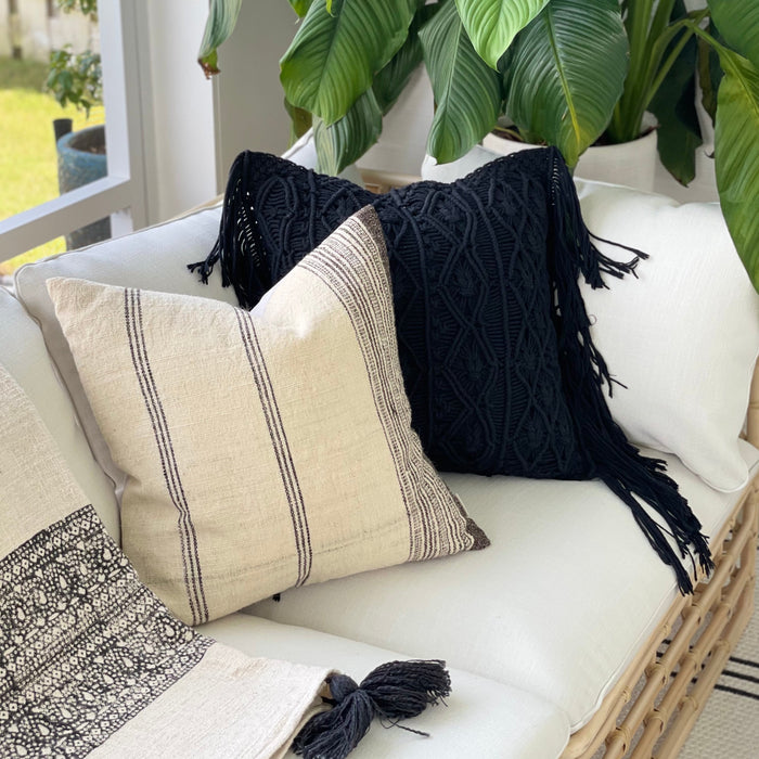 Usha pillow shown styled with our Coba pillow and Ira throw to create luxe boho vibes for this chic outdoor space.