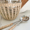 Rattan wrapped salad serving set shown with Seagrass Cage Serving Bowl. Sold separately.