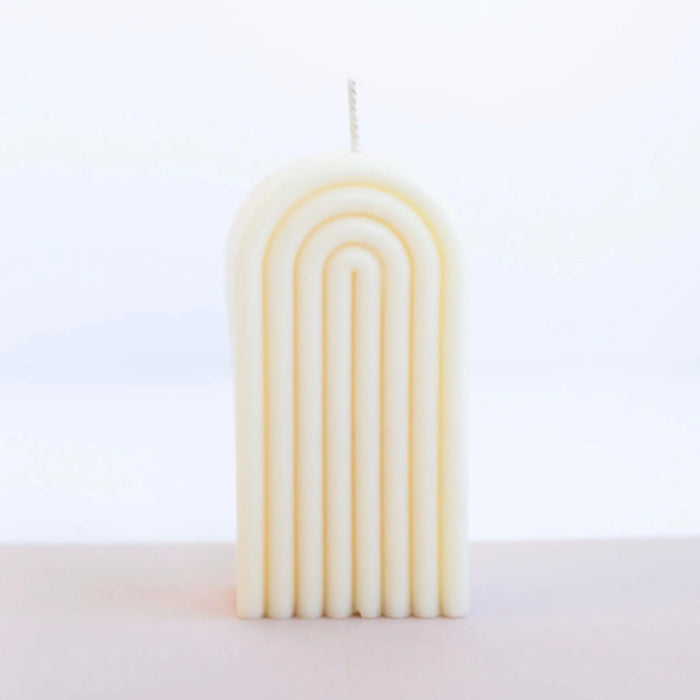 Tall Arch candle in cream. Hand poured in 100% American grown unscented soy wax. 4.2" H x 2.5" W x 1.5" D