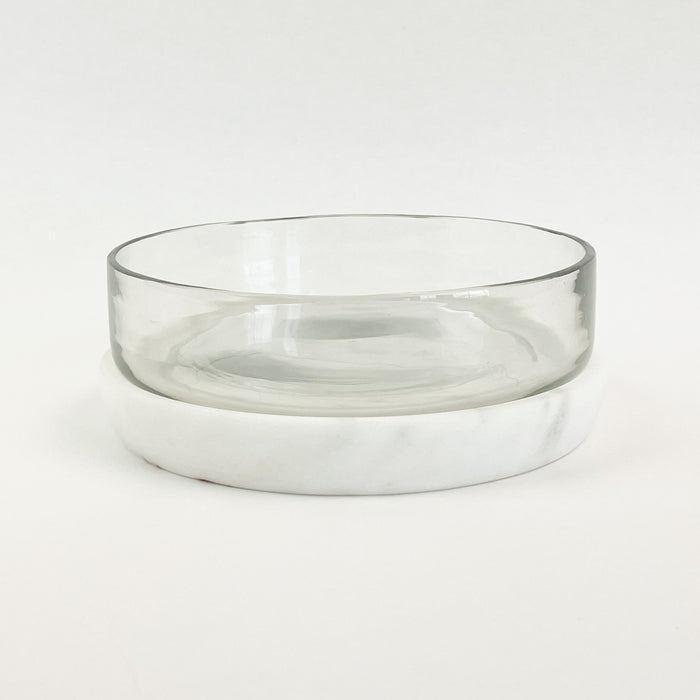 Small Glass + Marble serving  bowl for keeping items chilled on the table.  White marble coaster/tray can be placed in the freezer before serving and then used as a chilling plate while on the table.  Clear glass bowl measures 6” diameter 1.5” H.