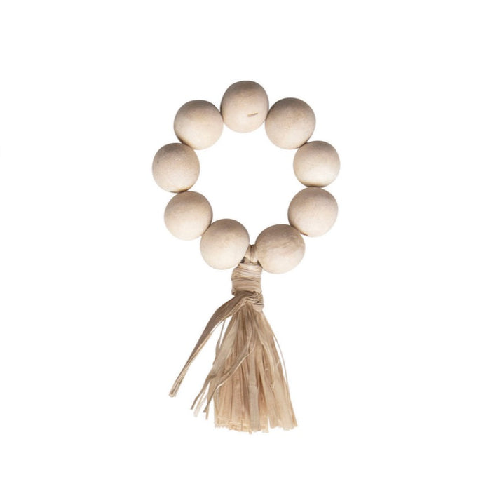 Hamptons napkin rings, set of 4. Pale raw wood beads finished with a raffia tassel are the perfect boho chic napkin ring. 