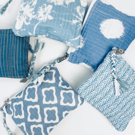 Assortment of "surf blue" Candy Pouches from By the Sea Organics. Sweet little zip pouch perfect for carrying your personal items while on the go. Each one is unique, each sold separately. 6" x 5"