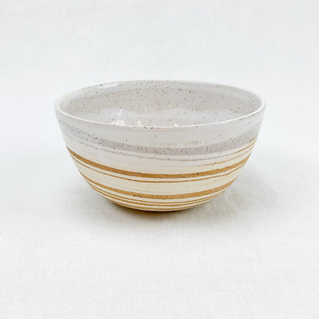 Ceramic Bowl with swirls of cream and sand stoneware, hand dipped in a creamy white glaze. By Rockwater Pottery.