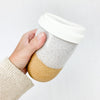 14 oz stoneware travel mug in natural clay with white speckled glaze. Comes with silicone lid.